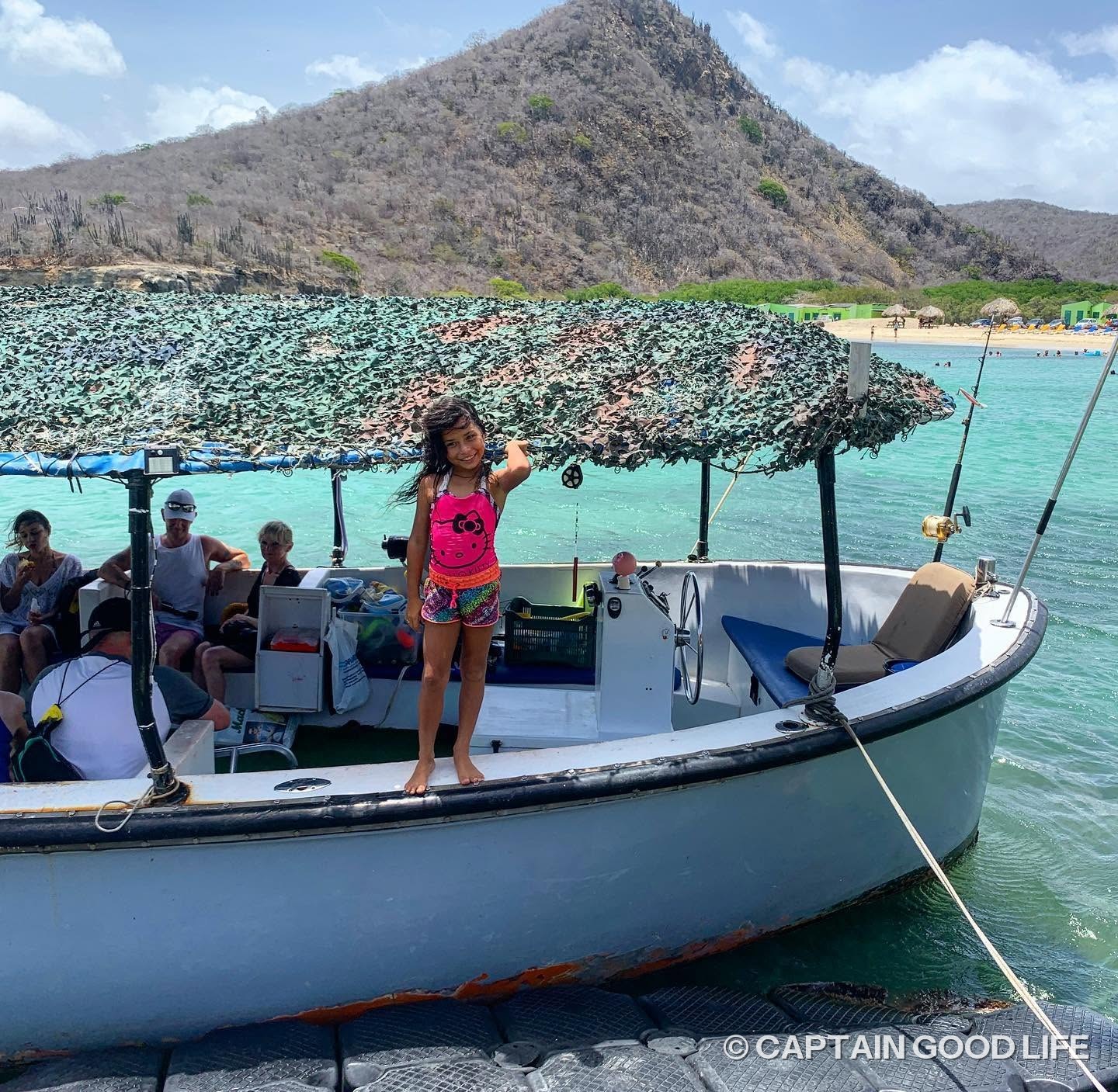 Guests on board Captain Goodlife's boat at Playa Santa Cruz